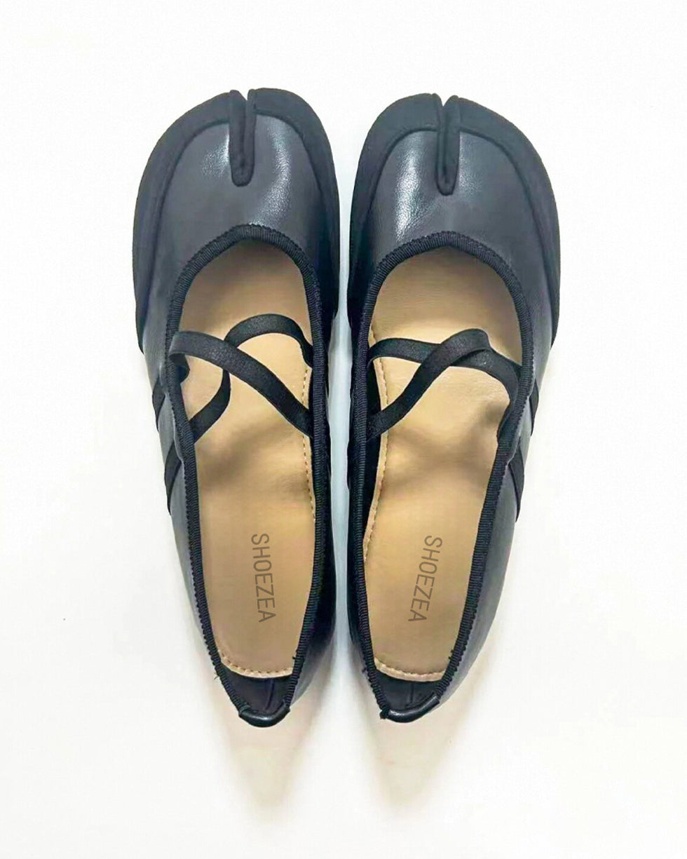 Tabi shoes Pair of black flat shoes with 'SHOEZEE' branding on a white background