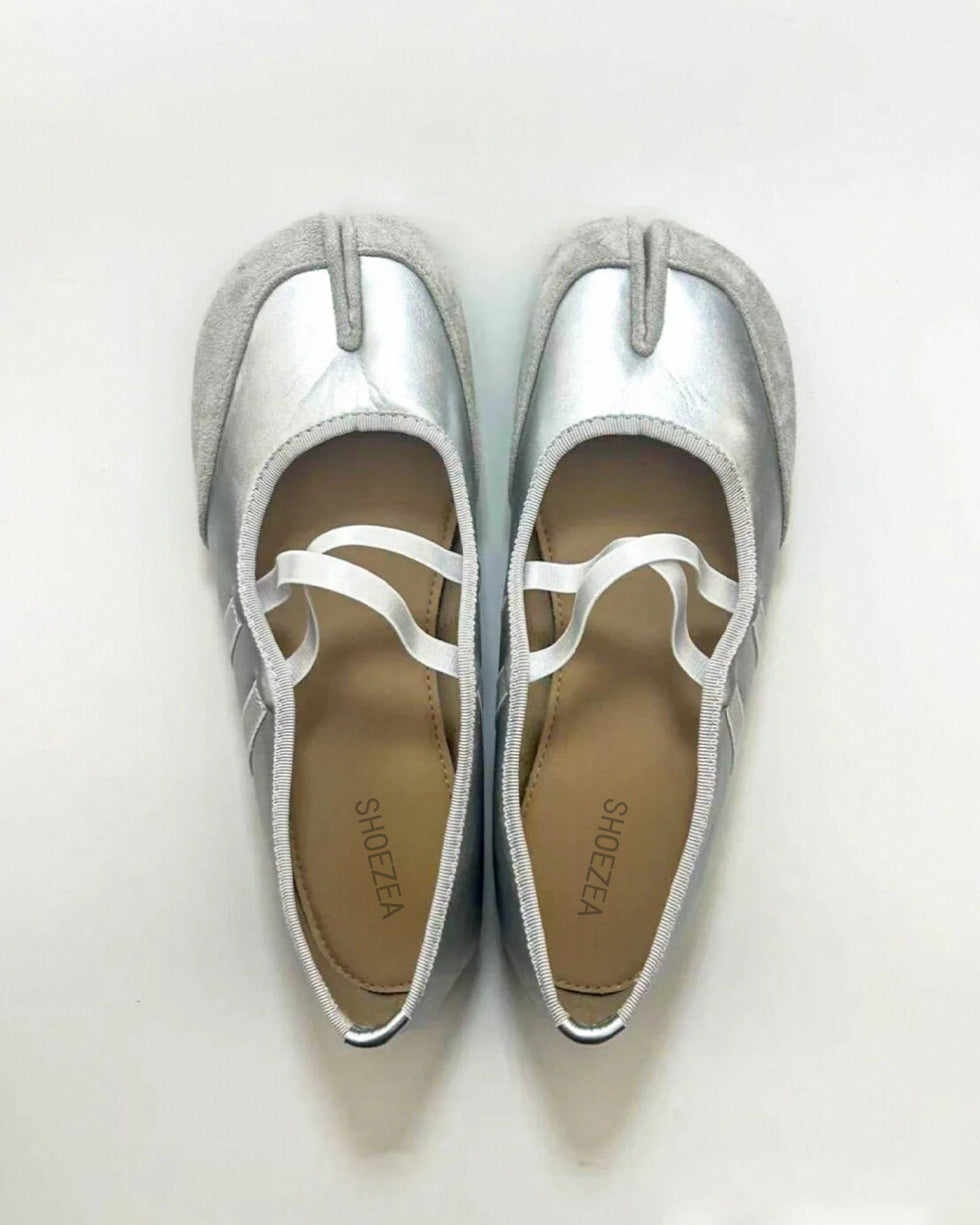 Tabi shoes Pair of silver flats with white straps on a light gray background
